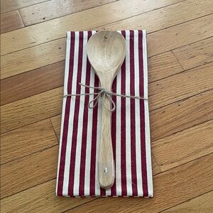Red and White Striped Kitchen Towel with Wooden Spoon